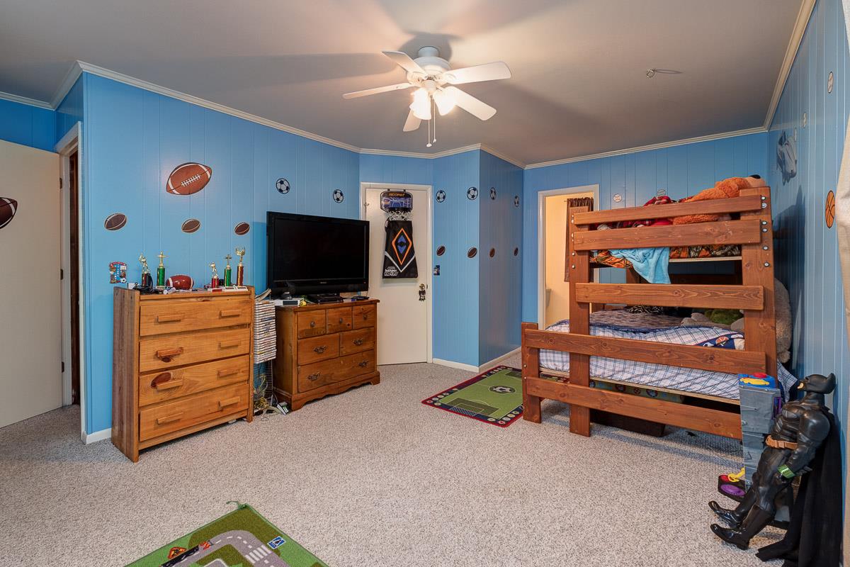 7187 Bahne Road Fairview, TN 37062 - Photo 22 of 30 a living room with furniture and a flat screen tv