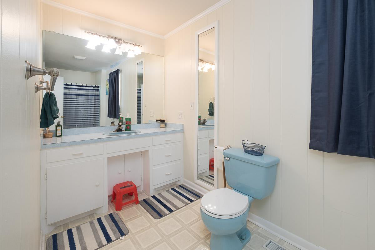 7187 Bahne Road Fairview, TN 37062 - Photo 23 of 30 a bathroom with a toilet sink and mirror