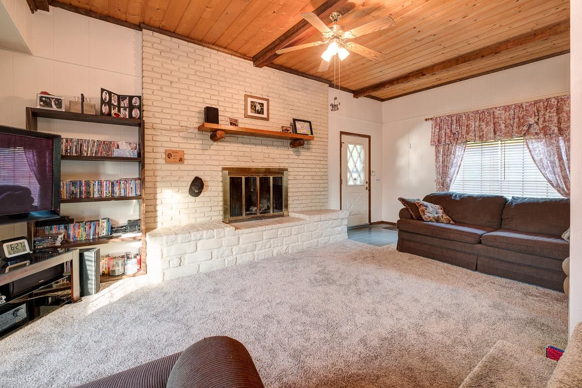 7187 Bahne Road Fairview, TN 37062 - Photo 6 of 30 a living room with furniture and a fireplace