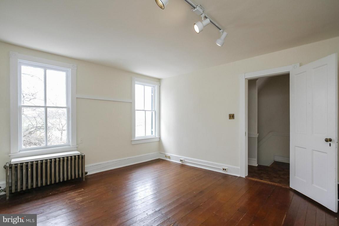 2015 Emory Road Reisterstown, MD 21136 - Photo 12 of 30 an empty room with wooden floor and windows