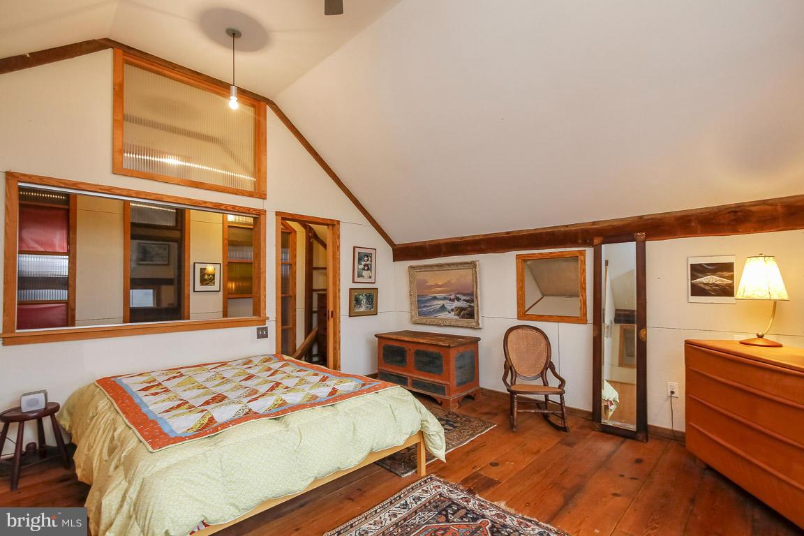 2015 Emory Road Reisterstown, MD 21136 - Photo 26 of 30 a bedroom with a bed a table and chair