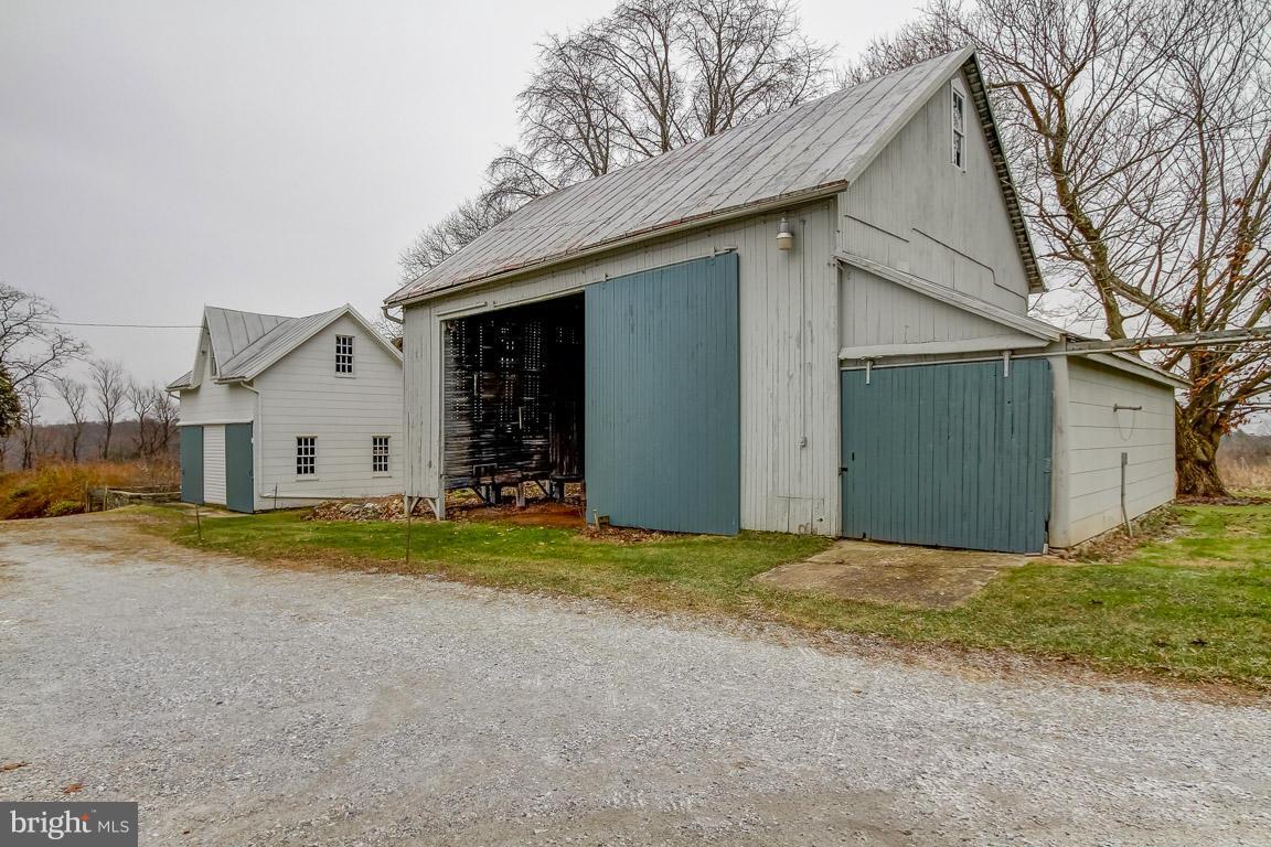 2015 Emory Road Reisterstown, MD 21136 - Photo 30 of 30 a view of a house with a yard and garage