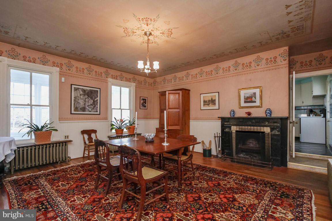 2015 Emory Road Reisterstown, MD 21136 - Photo 6 of 30 a living room with furniture a chandelier and a fireplace
