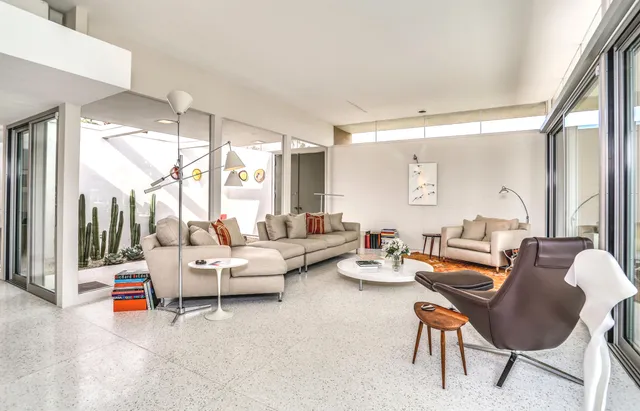 a living room with furniture and a large window
