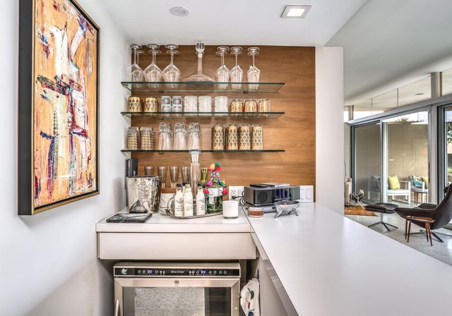 a kitchen with stainless steel appliances granite countertop a sink and a stove
