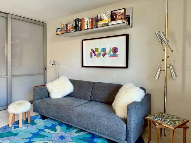 a living room with furniture and a rug