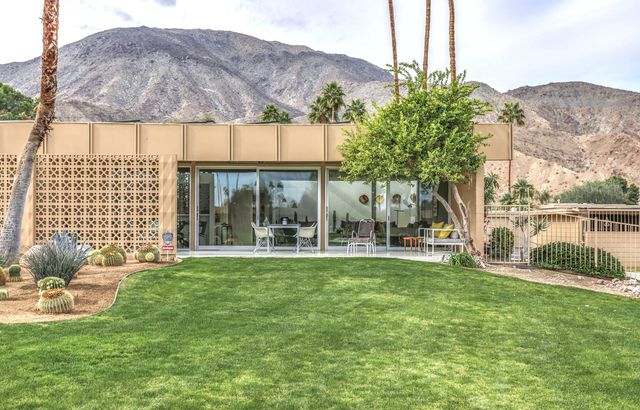 a view of a swimming pool with a patio