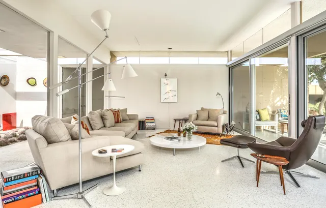 a living room with furniture and a large window