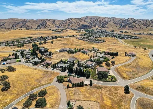 an aerial view of residential building and ocean view