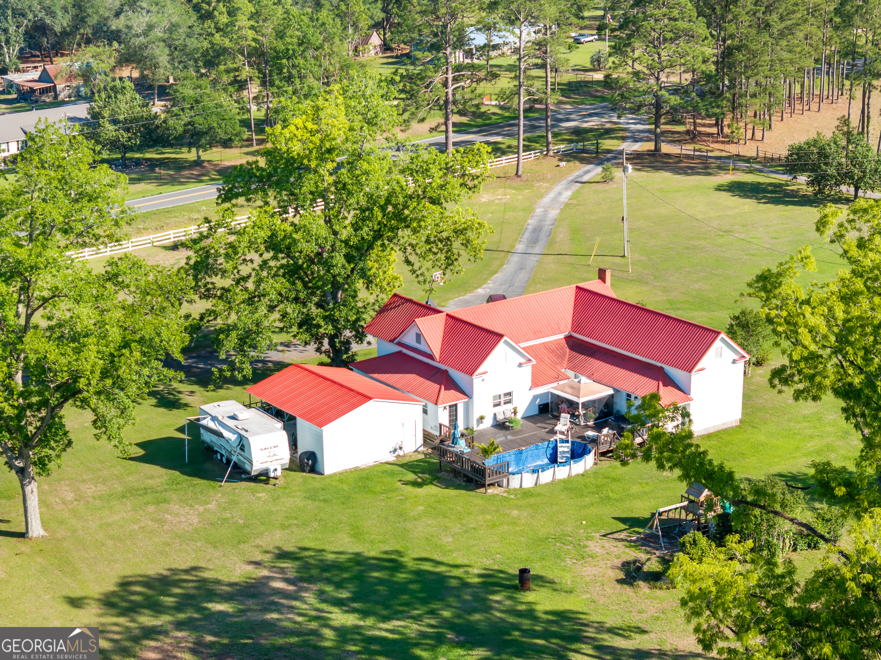 5065 10 Mile Road Baxley, GA 31513 - Photo 58 of 70 an aerial view of residential houses with outdoor space and swimming pool