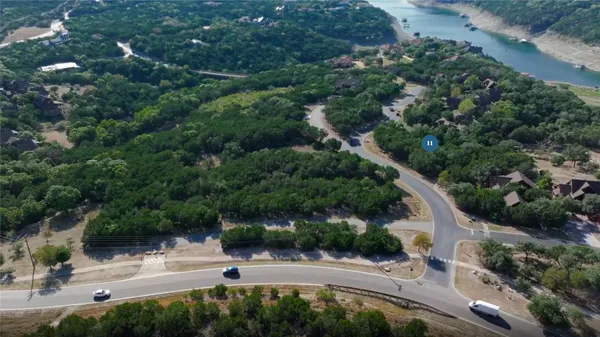 an aerial view of a house with outdoor space and street view