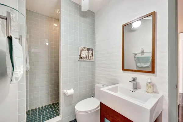 a bedroom with a bed and a couch