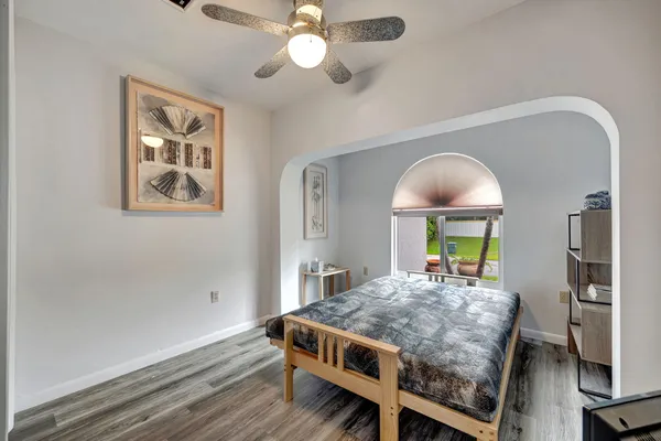 a view of house with swimming pool and green space