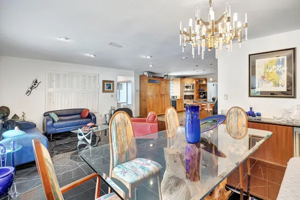 a view of a dining room with furniture and window