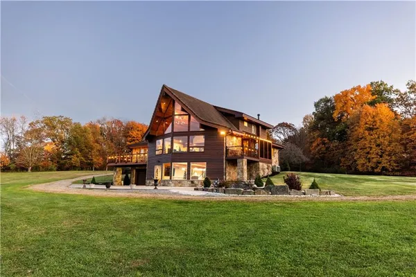 a view of a house with a big yard