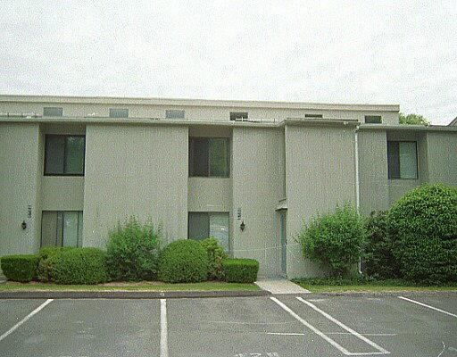 45 Lawson Lane, Unit 45 Ridgefield, CT 06877 - Photo 1 of 1 a view of a building with a garden and plants