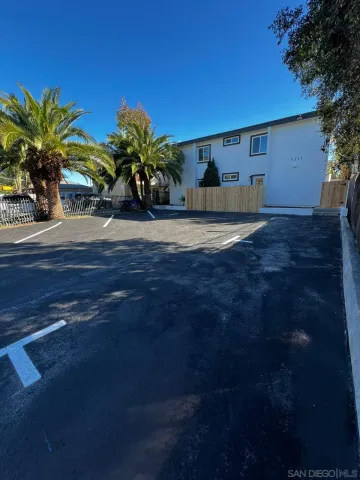 a view of a house with a flower garden