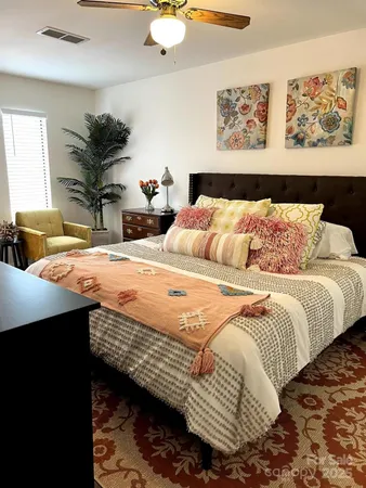 a bedroom with a bed and dresser