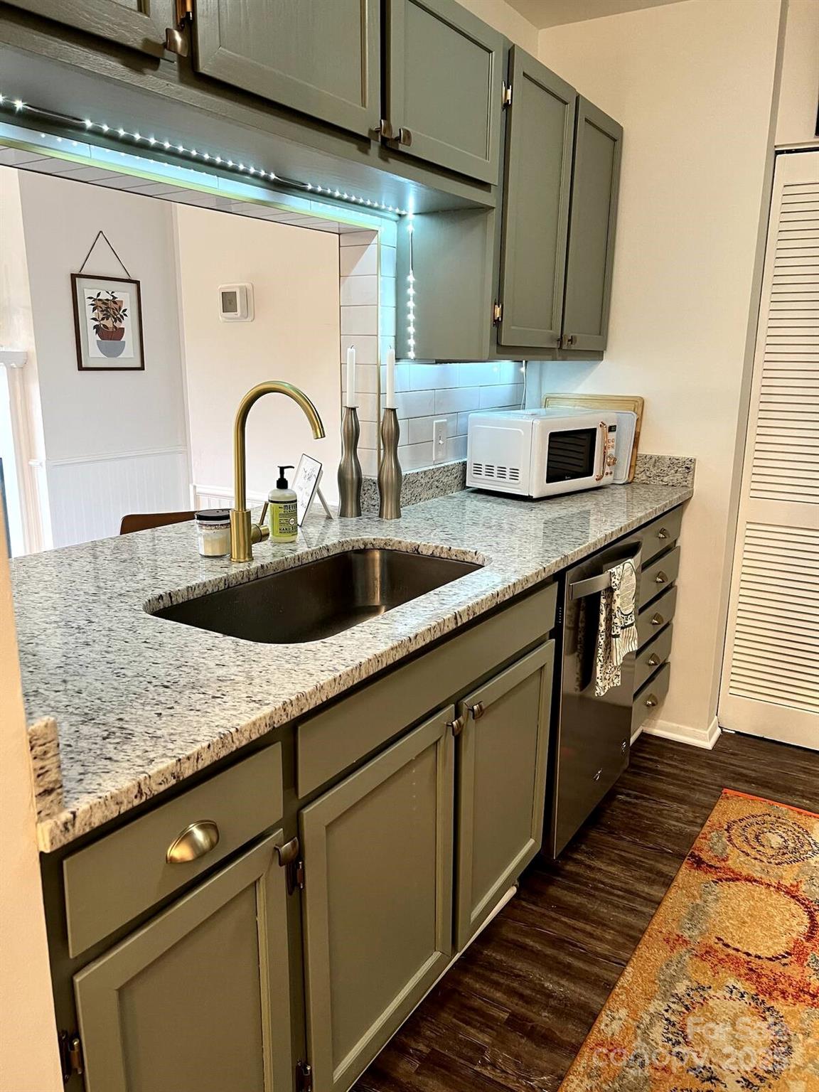 229 Windsor Point Road, Unit 6D Columbia, SC 29223 - Photo 6 of 7 a kitchen with granite countertop a sink and cabinets