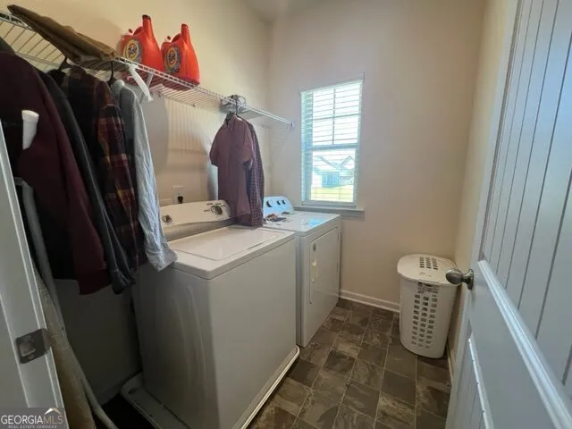 a utility room with dryer and washer