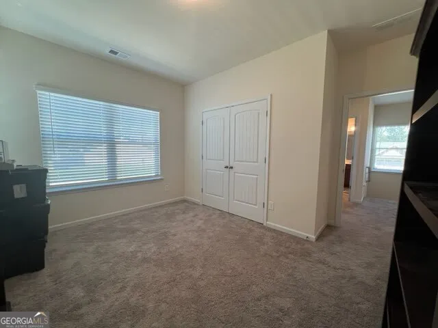 an empty room with windows