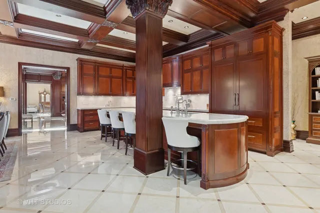 a view of a dining room with furniture wooden floor and chandelier