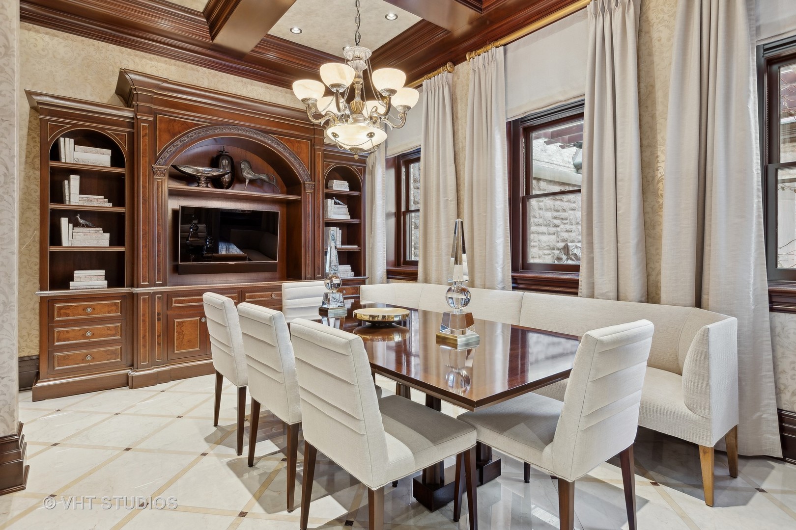 915 North Dearborn Street Chicago, IL 60610 - Photo 19 of 61 a view of a dining room with furniture and a chandelier