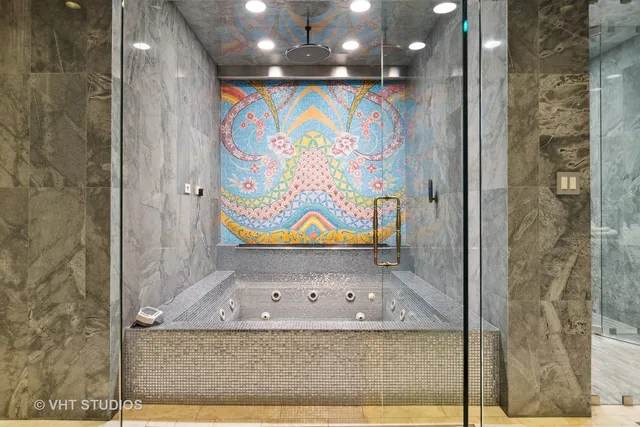 a view of walk in closet and bedroom