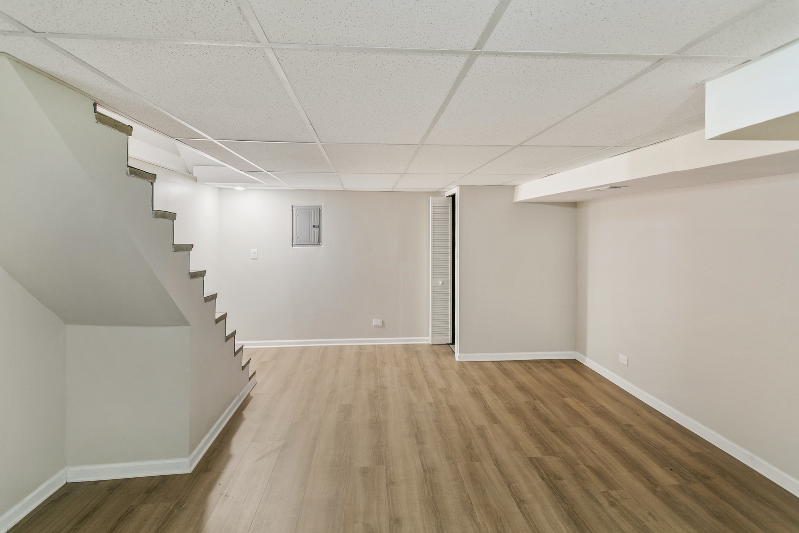 27W031 Cooley Avenue Winfield, IL 60190 - Photo 13 of 17 a view of an empty room with wooden floor