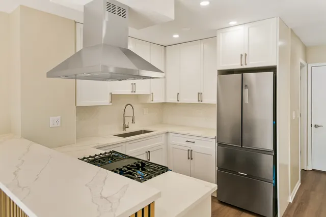 a kitchen with a stove and a sink