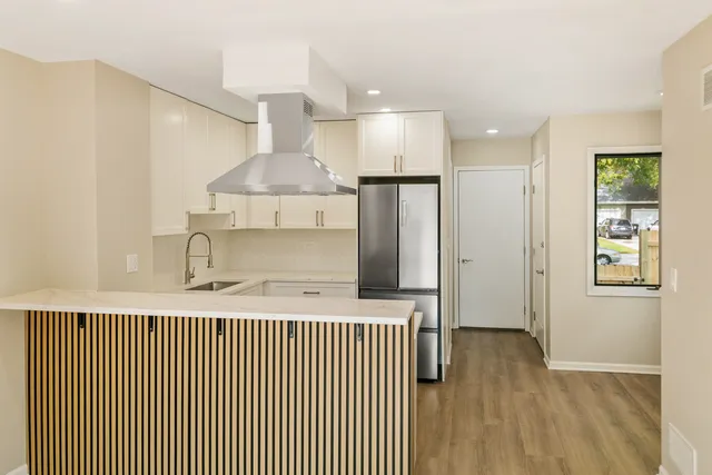 a bathroom with a shower and a sink