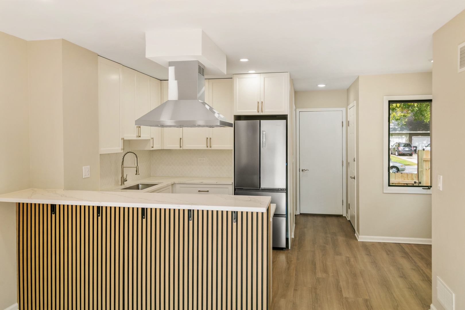 27W031 Cooley Avenue Winfield, IL 60190 - Photo 6 of 17 a kitchen with stainless steel appliances kitchen island granite countertop a refrigerator and a sink