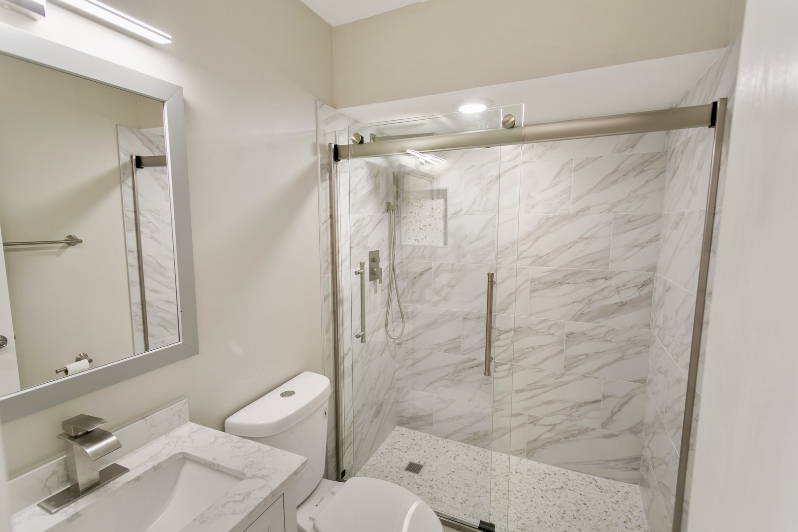 27W031 Cooley Avenue Winfield, IL 60190 - Photo 7 of 17 a bathroom with a shower and a sink