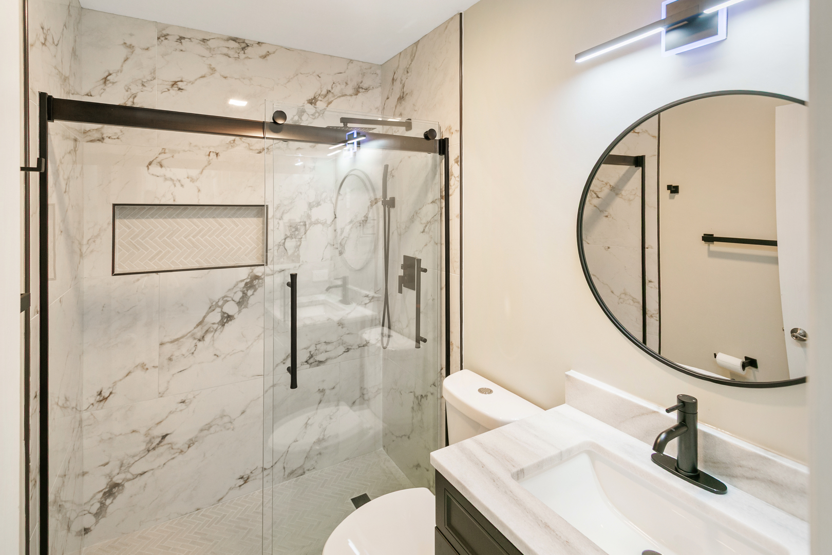 27W031 Cooley Avenue Winfield, IL 60190 - Photo 10 of 17 a bathroom with a sink toilet and shower