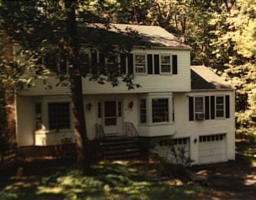 87 Standish Drive Ridgefield, CT 06877 - Photo 1 of 1 a front view of a house with a yard