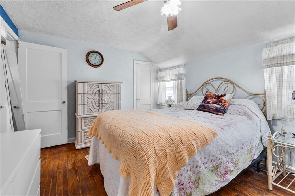 661 Dunster Street Pittsburgh, PA 15226 - Photo 17 of 25 a bedroom with a bed and a large mirror