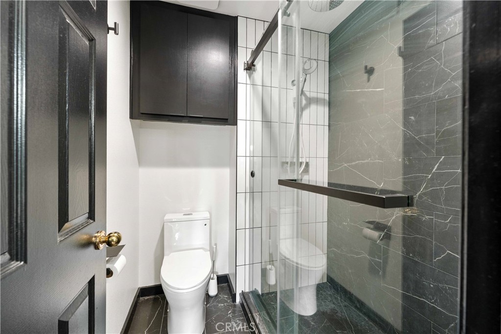 5363 Cornwall Avenue Riverside, CA 92506 - Photo 11 of 23 a bathroom with a toilet and a shower