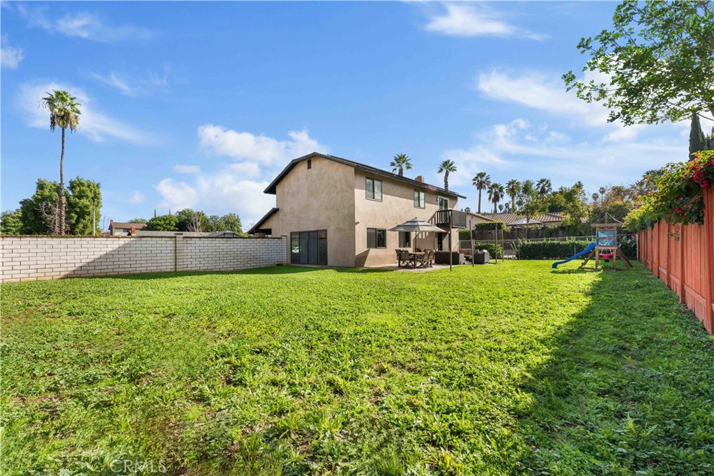 5363 Cornwall Avenue Riverside, CA 92506 - Photo 21 of 23 a view of a house with a big yard plants and large trees