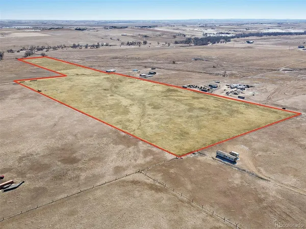 an outdoor space with wooden floor