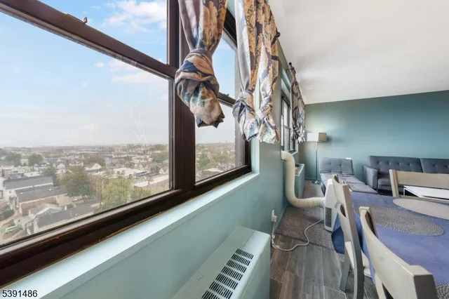 a view of a living room with a large window