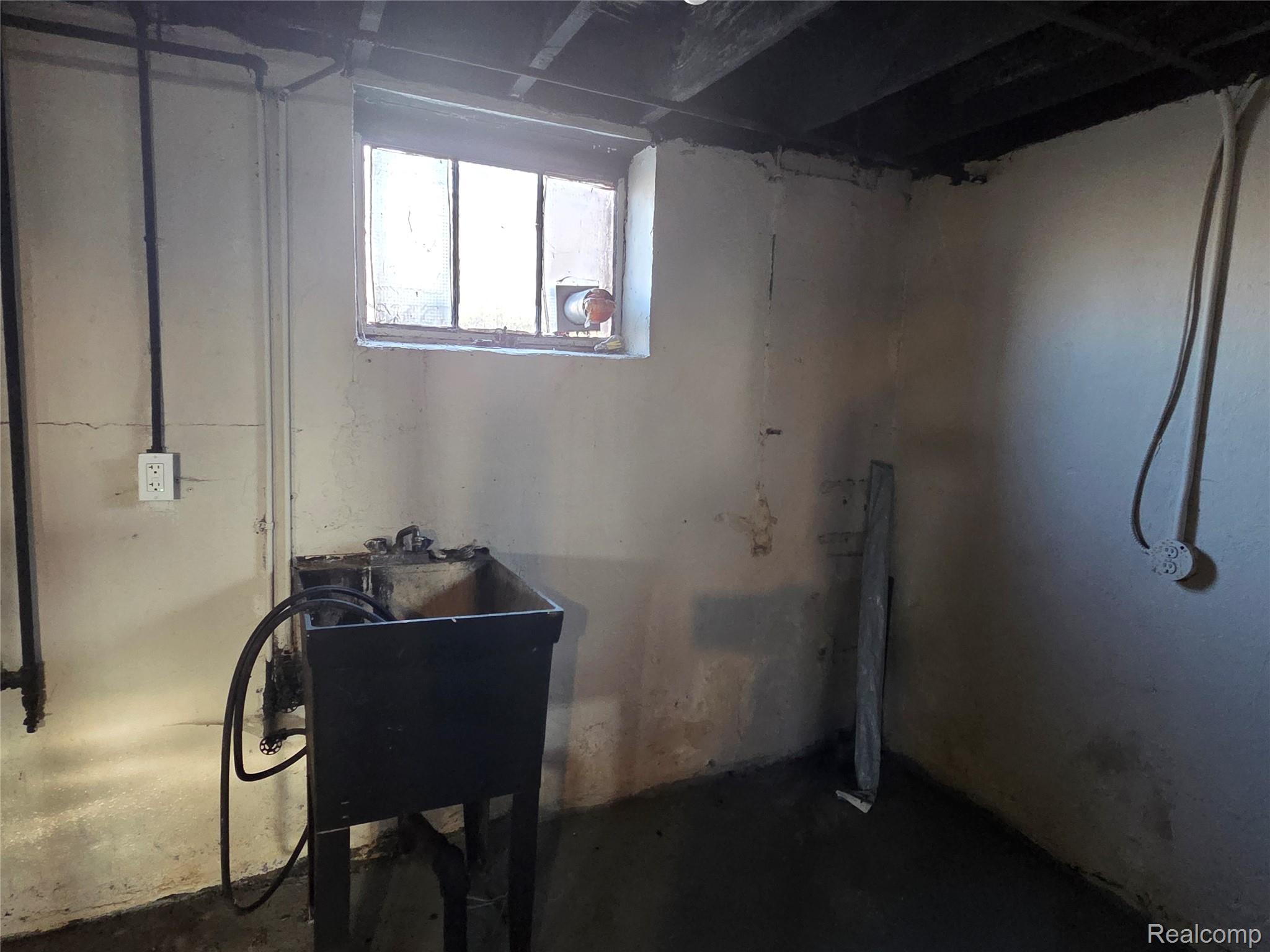 5274 Nottingham Road Detroit, MI 48224 - Photo 15 of 18 Basement featuring a sink