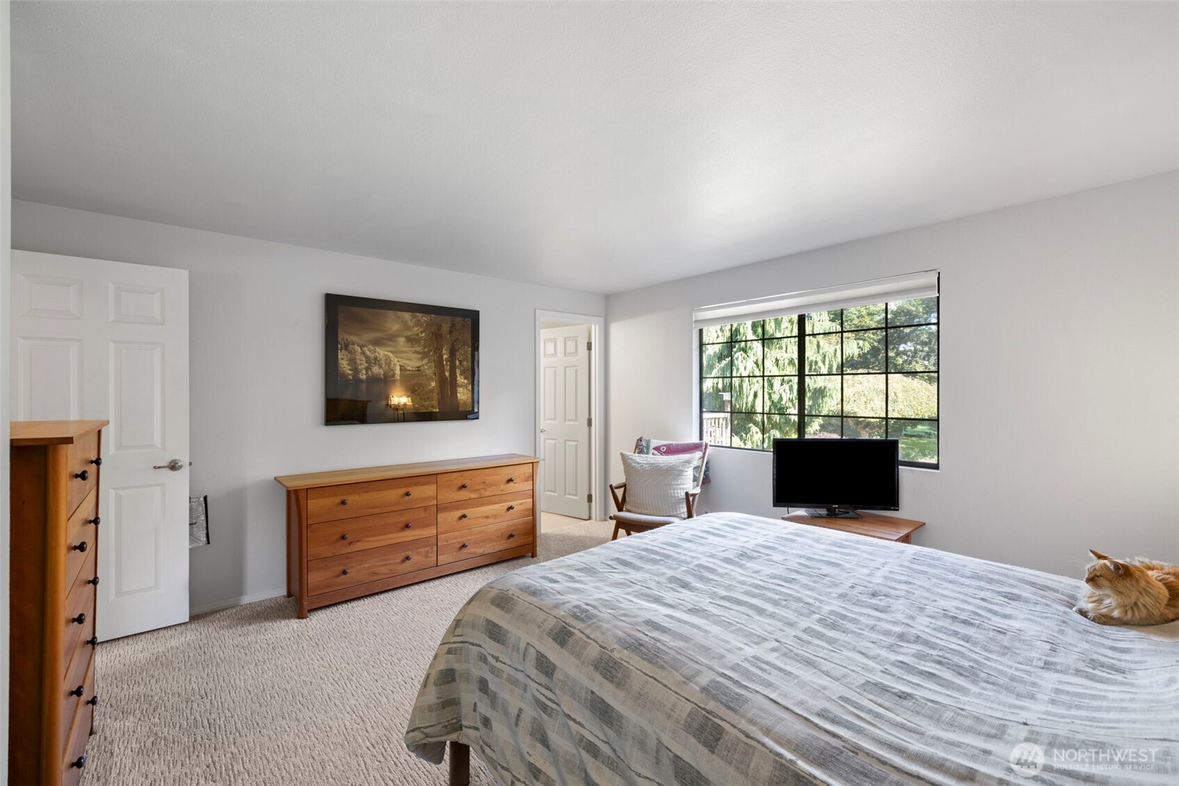 834 Cary Road Edmonds, WA 98020 - Photo 22 of 40 a bedroom with a bed and a dresser next to a window