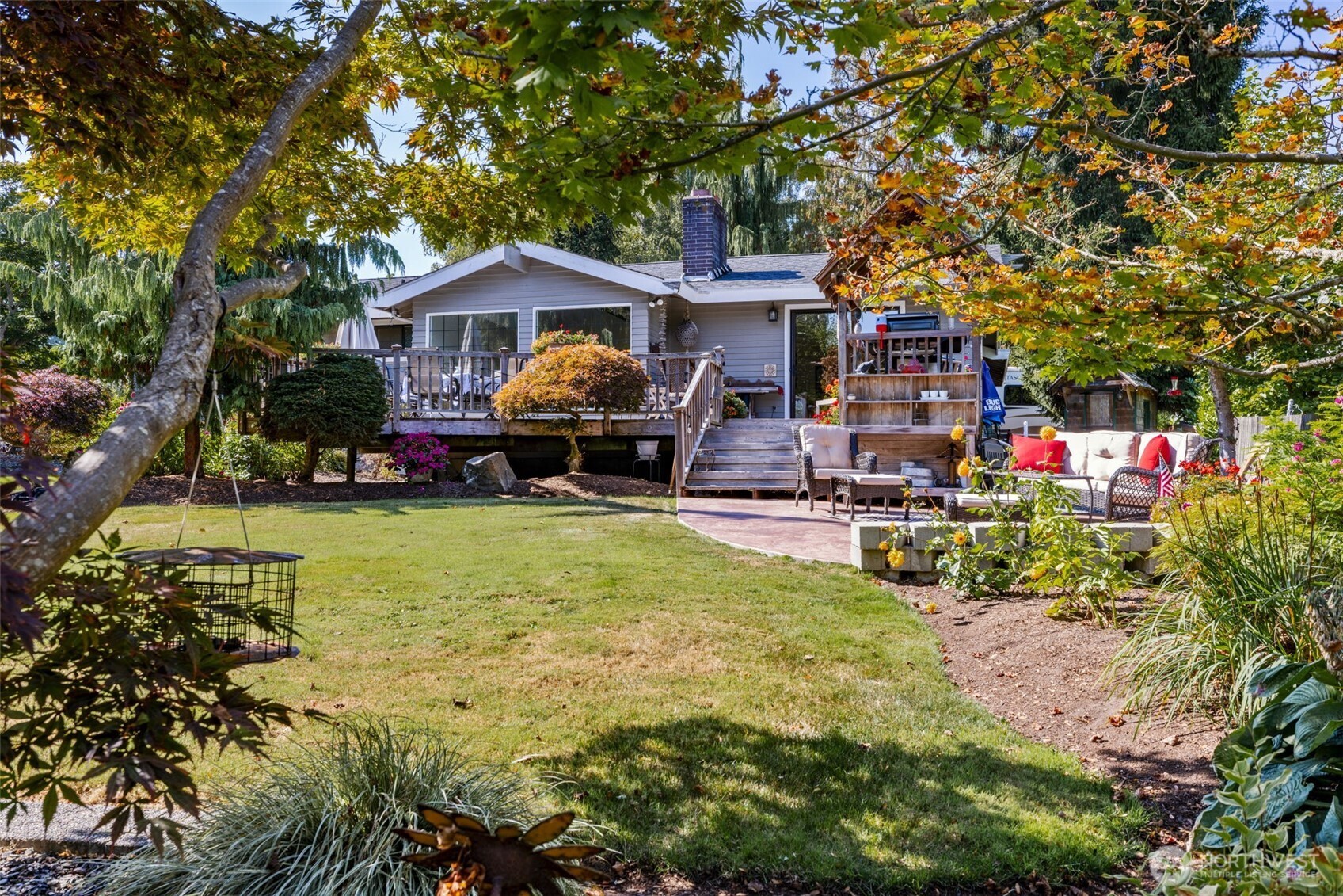 834 Cary Road Edmonds, WA 98020 - Photo 24 of 40 a front view of a house with a yard table and chairs