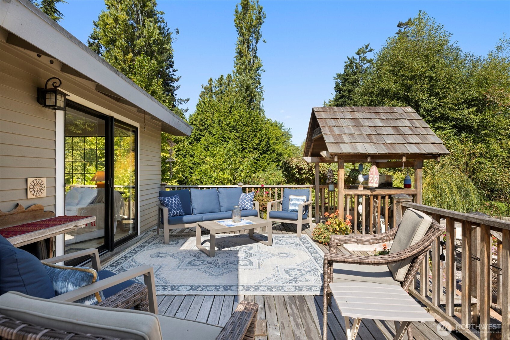 834 Cary Road Edmonds, WA 98020 - Photo 26 of 40 a view of a patio with couches table and chairs and potted plants