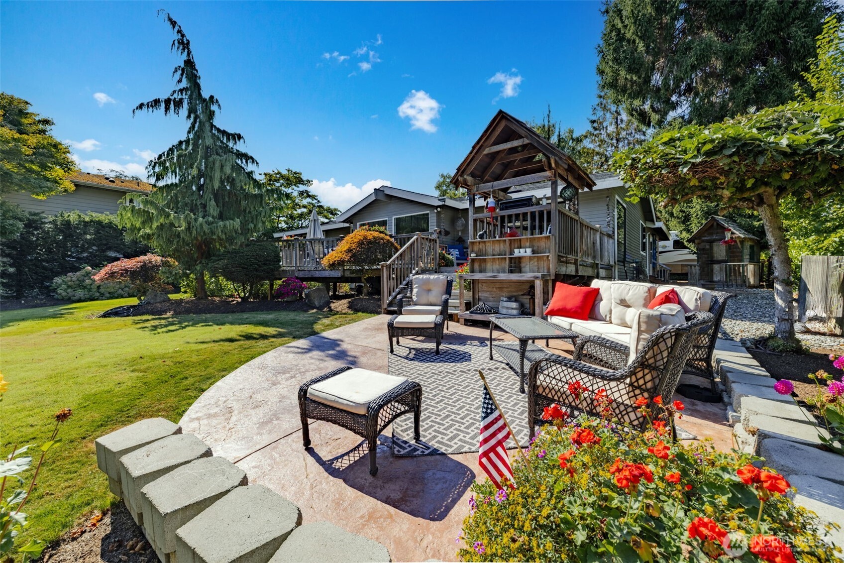 834 Cary Road Edmonds, WA 98020 - Photo 28 of 40 a view of a chairs and table in backyard of the house