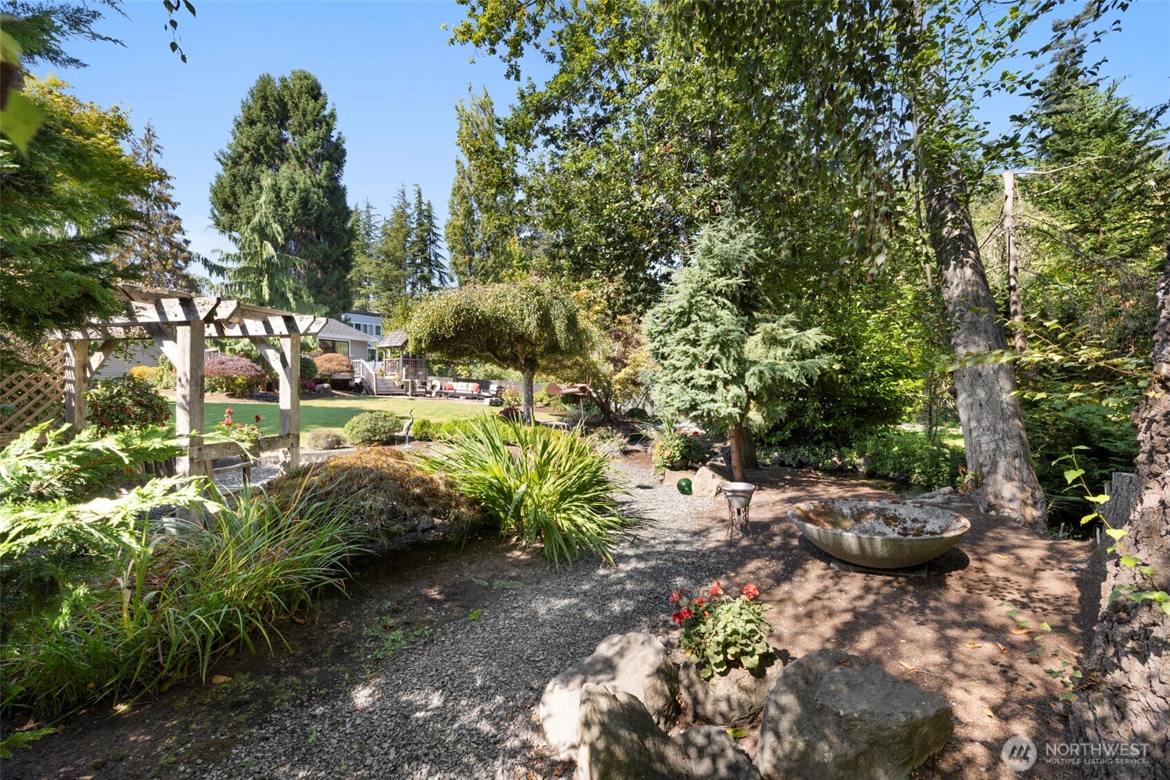 834 Cary Road Edmonds, WA 98020 - Photo 32 of 40 a backyard of a house with lots of green space
