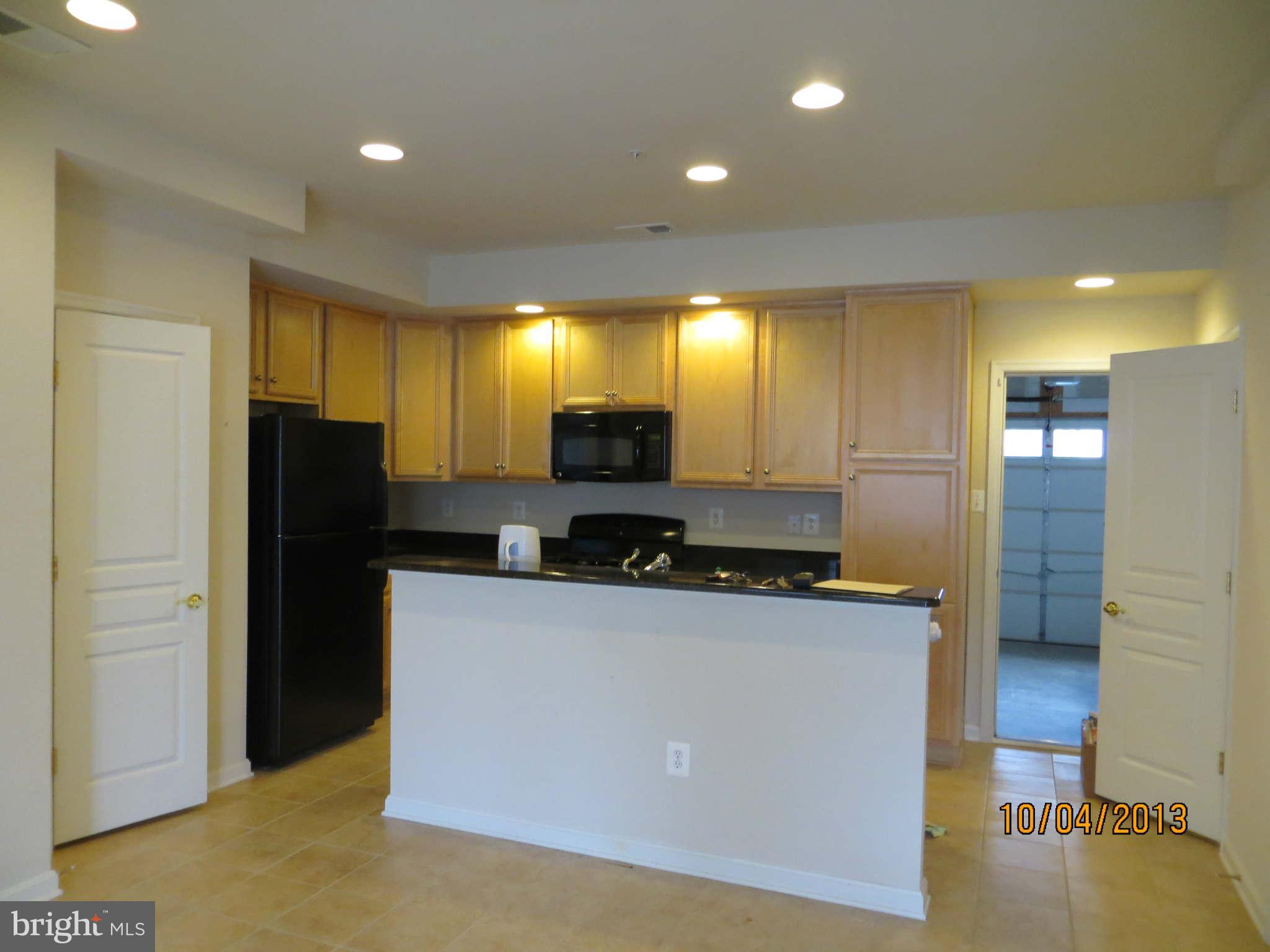 1826 Monocacy View Circle, Unit 50A Frederick, MD 21701 - Photo 2 of 6 a kitchen with stainless steel appliances granite countertop a refrigerator a stove and a sink