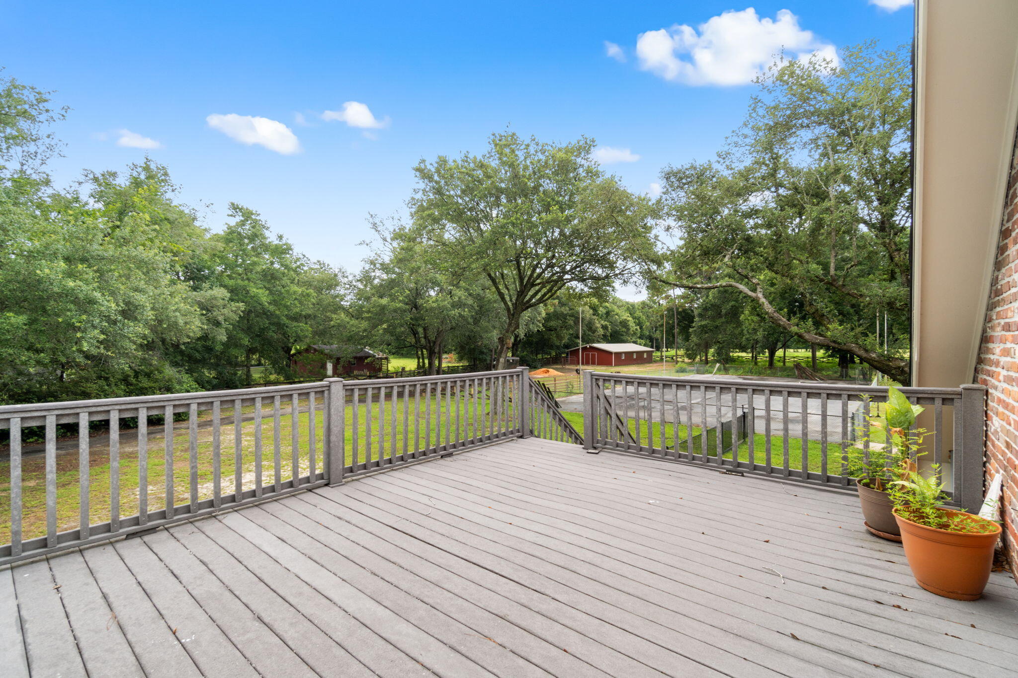 5750 Windham Road Milton, FL 32570 - Photo 13 of 77 a view of a balcony with wooden floor