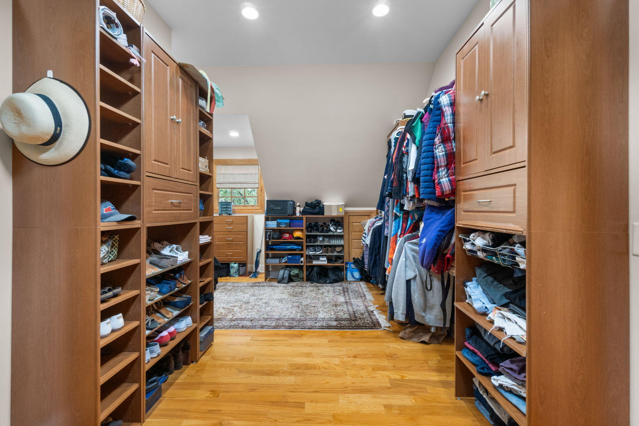 5750 Windham Road Milton, FL 32570 - Photo 21 of 77 a view of walk in closet with clothes and shoes