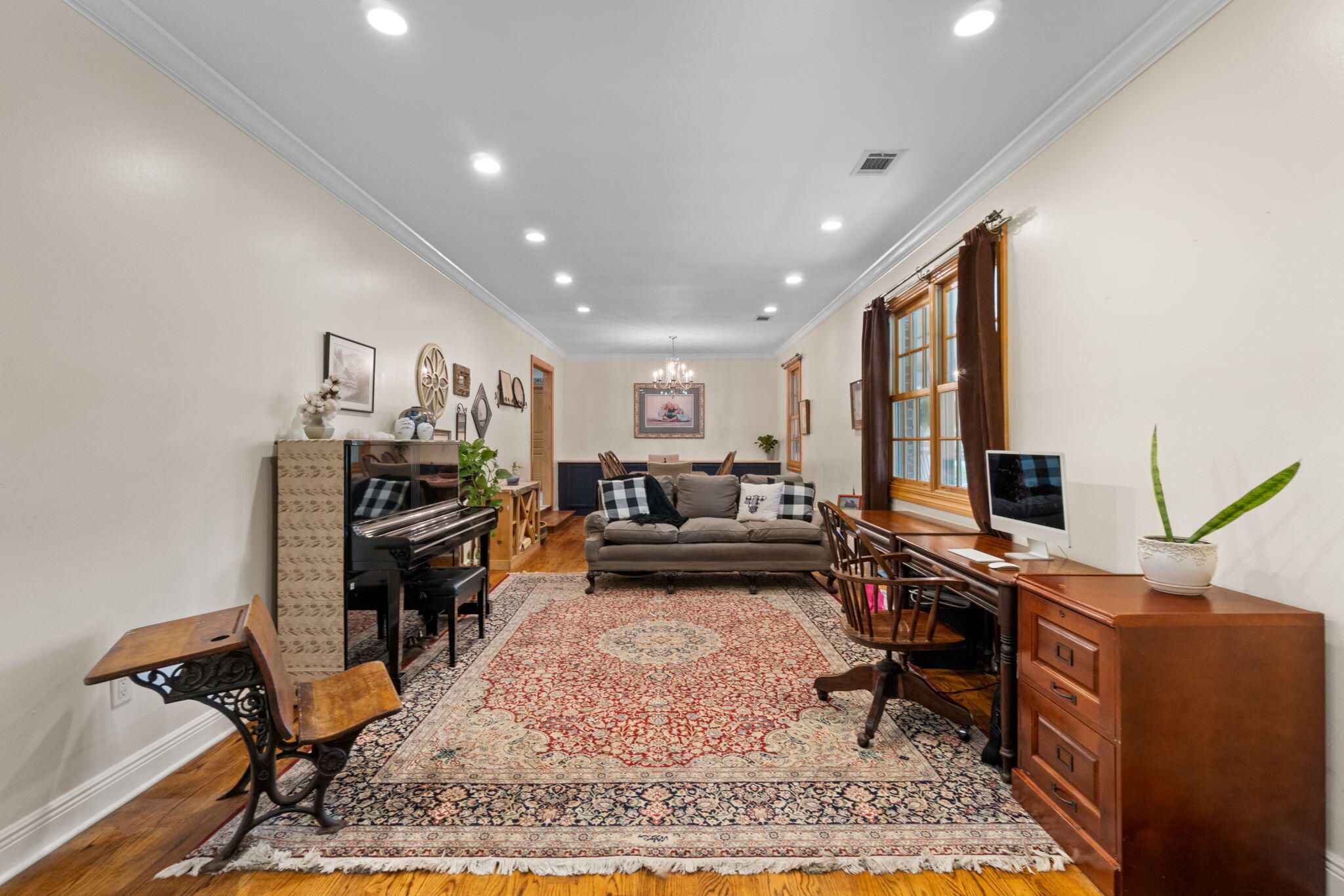 5750 Windham Road Milton, FL 32570 - Photo 34 of 77 a living room with furniture and a piano
